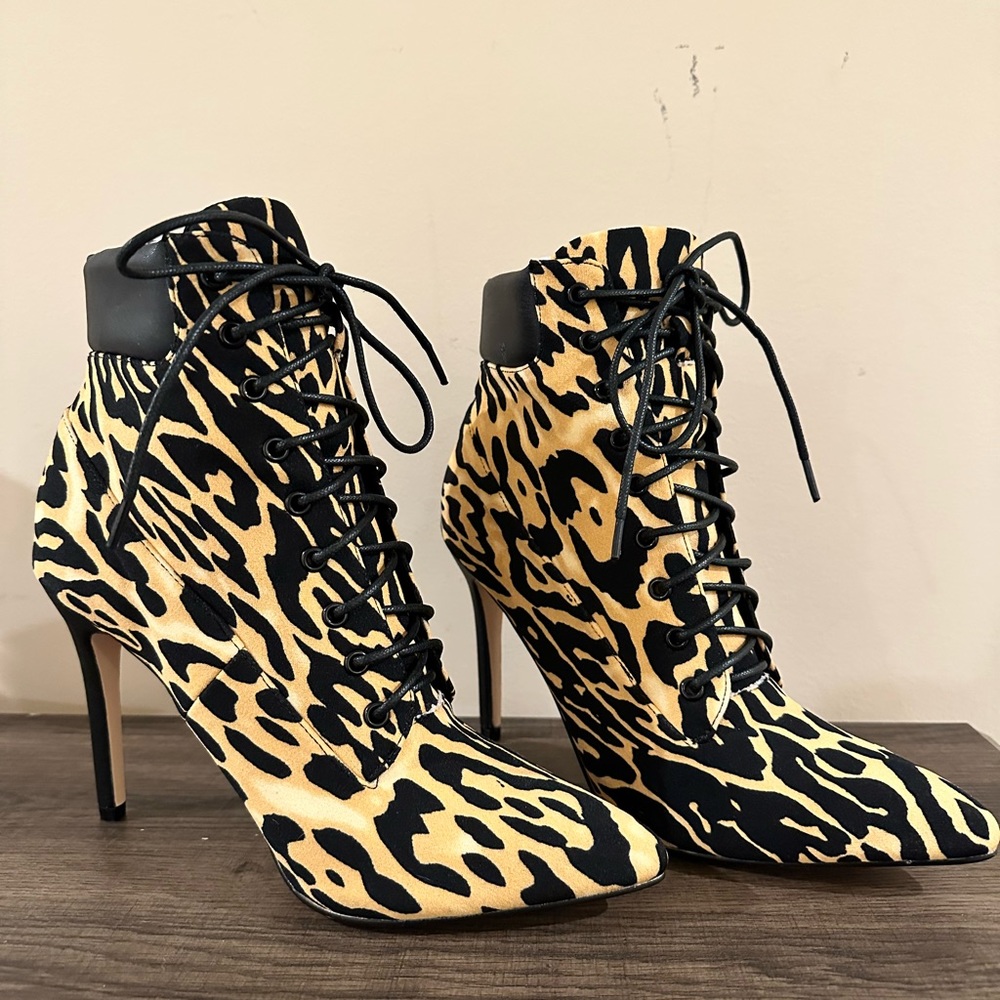 Animal print heeled booties. Size 9. New/perfect condition.